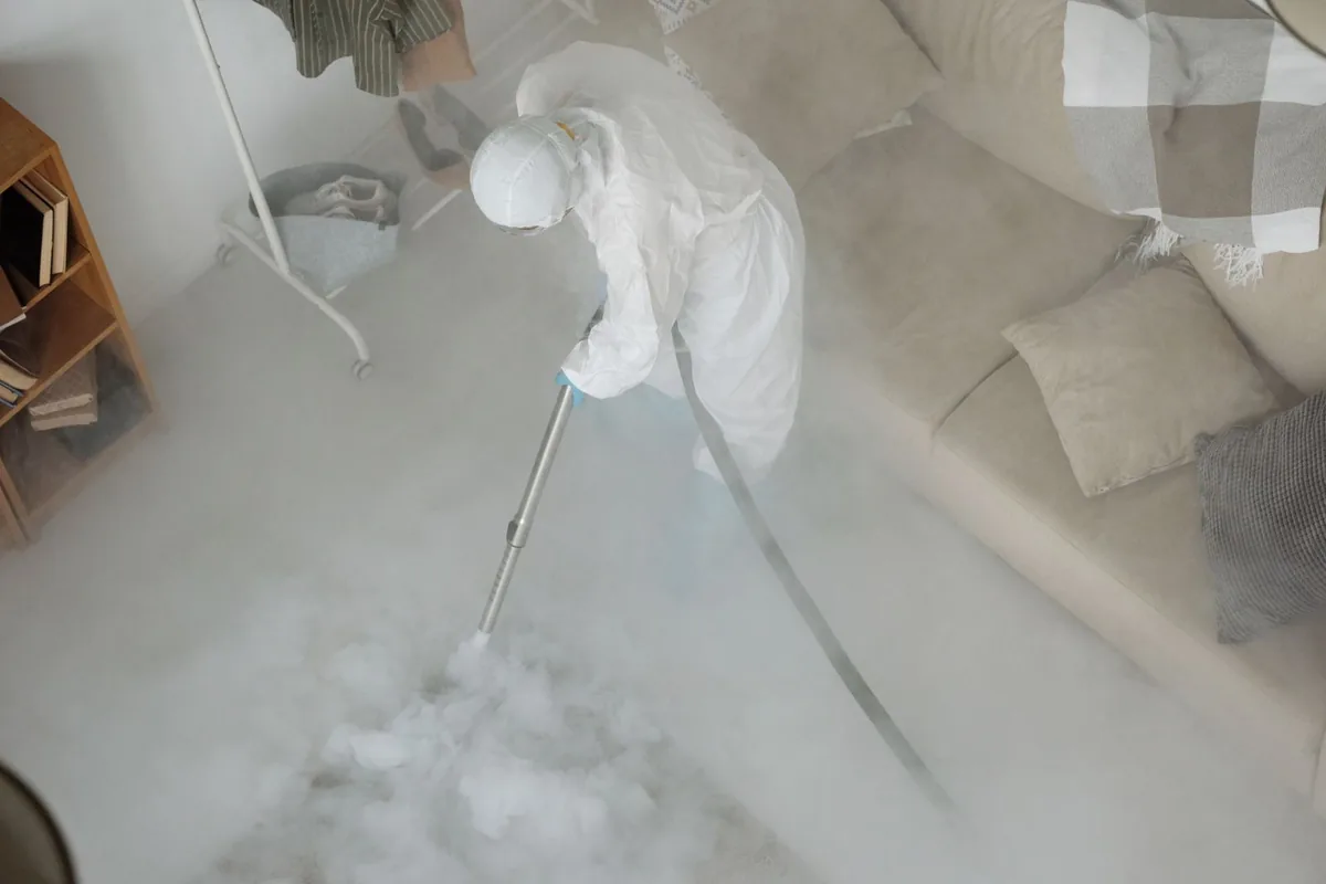 Biohazard cleanup technician in protective equipment, Reedsville, WI